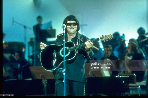 Roy Orbison performing live on stage at Kings Hall in Manchester for a recording of The International Pop Proms, circa 1976. (Photo by Peter Bolton TV Times